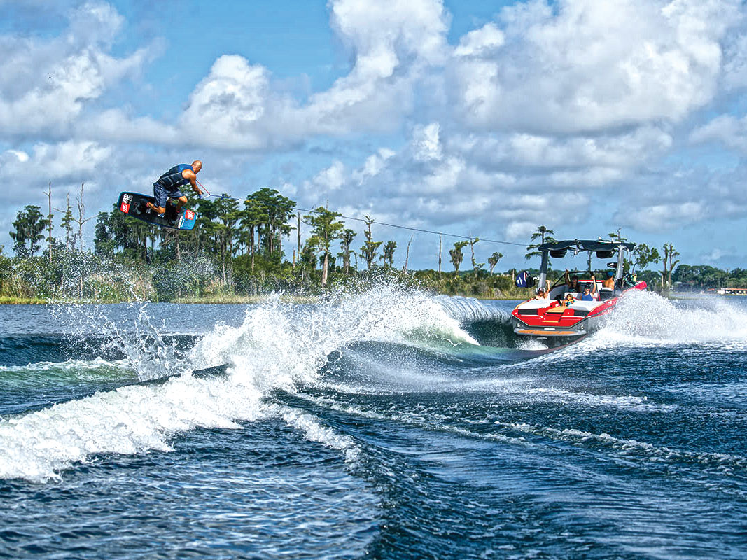 Wakeboarder launching over the wake